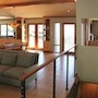AFTER: View from same location. Remodeled Family room, Dining area, and Front entry
