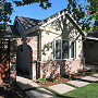 New Front Elevation
New dining room bump-out with new brick arch side yard entry.