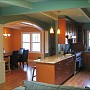 Palo Alto remodel - View of new dining room, entry hall, and kitchen, from central room.